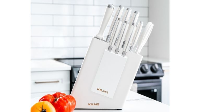 white knife block with white knives in white kitchen
