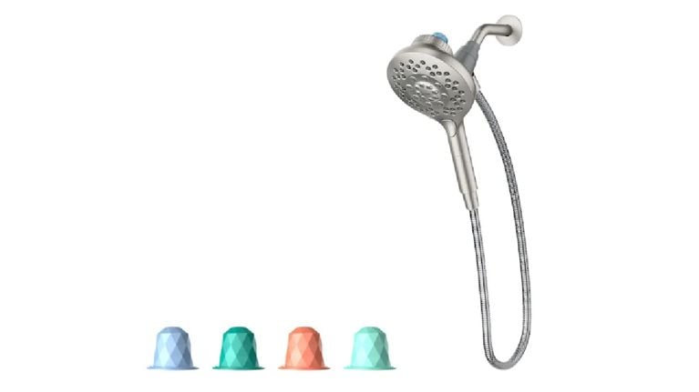stainless steel shower head alongside colourful aromatherapy pods