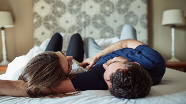 woman lying down with partner