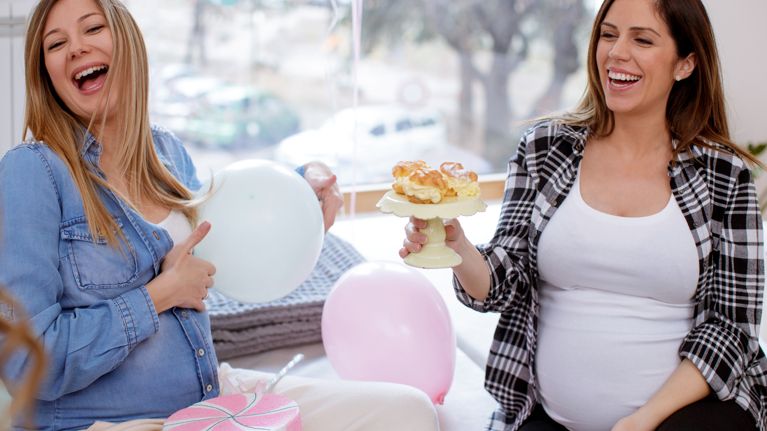 Friends laughing on babyshower