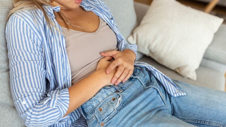 woman touching her stomach