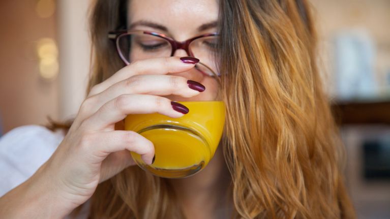 Woman drinking juice