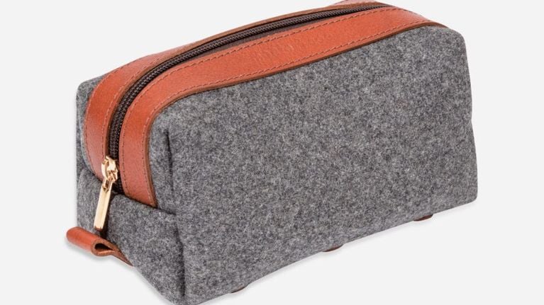 grey woollen toiletries kit with orange leather details