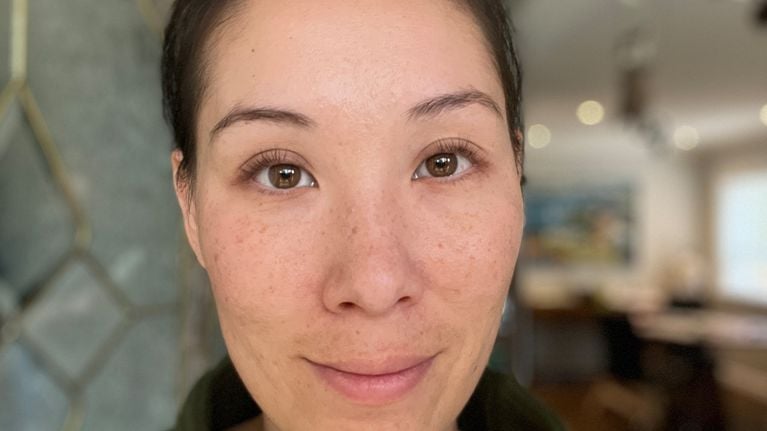 A close-up of a woman's face after getting lash lift and tint.