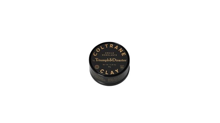 black tin of hair paste