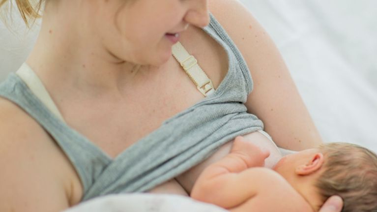 Mother and baby receiving breastfeeding support