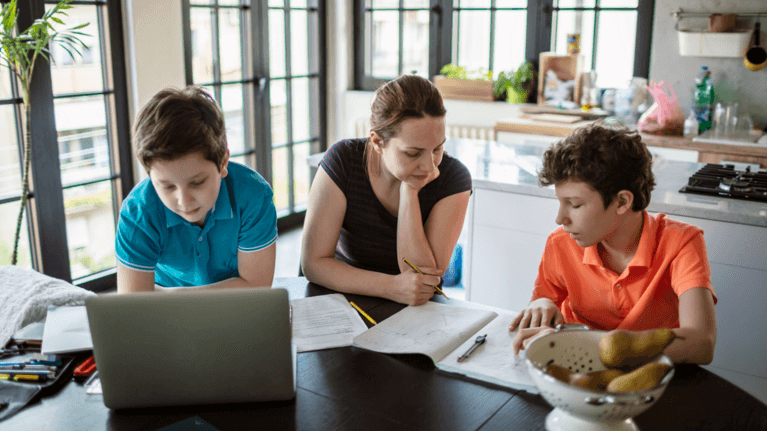 parents helping a child with school work