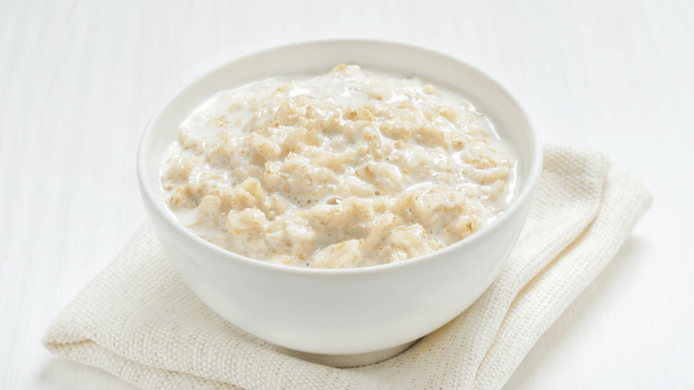 bowl of oatmeal sitting on a table