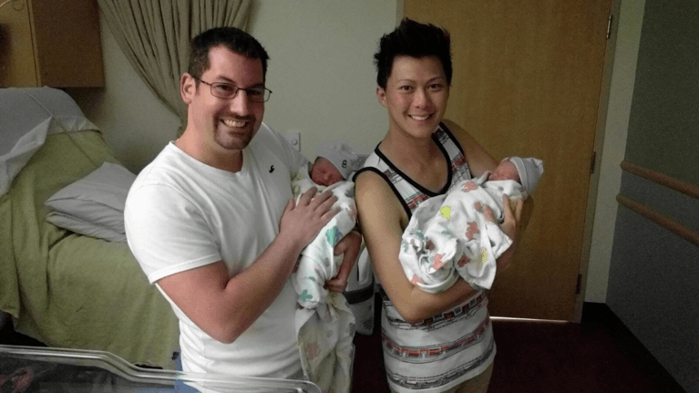 Author's Sunshine's two intended parents holding the babies she delivered via surrogacy