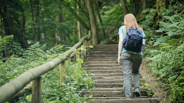 woman walking in a forest