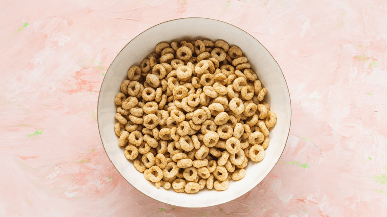 overhead shot of a bowl of cheerios sitting on a table
