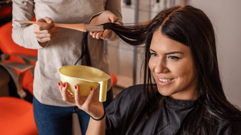 woman at the salon getting her hair dyed