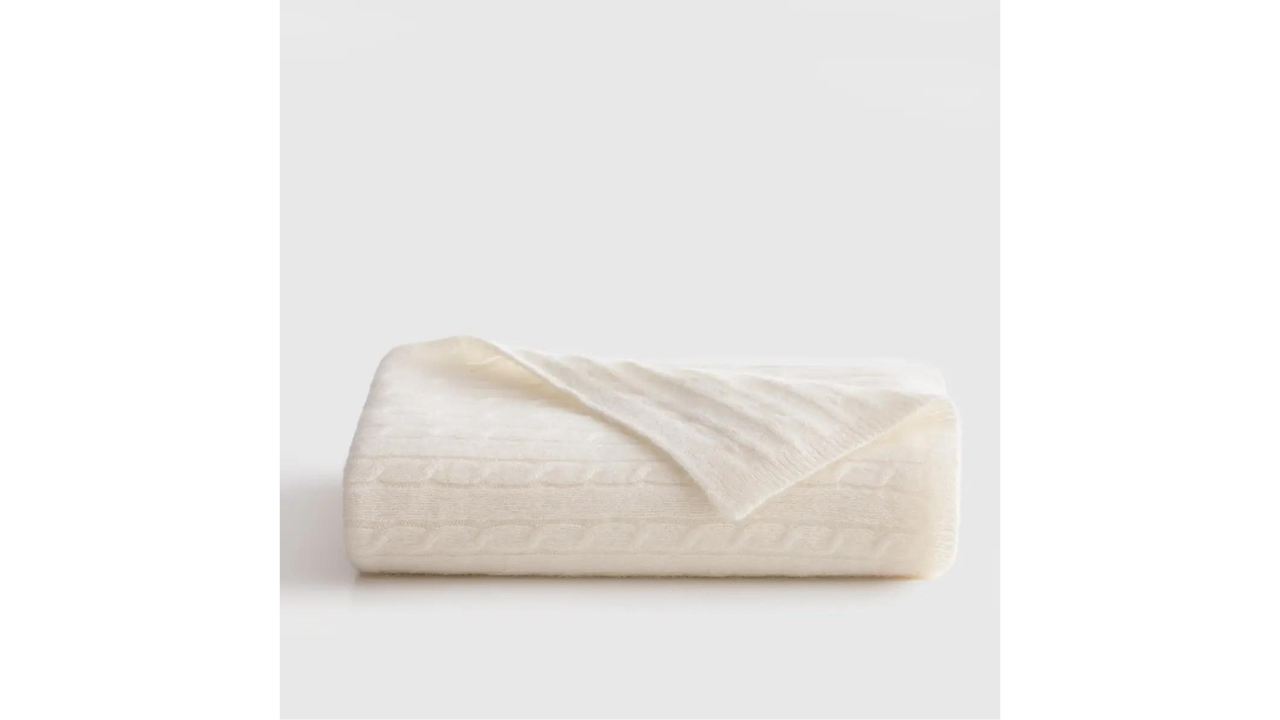 Quince Luxe Cable Knit Cashmere Baby Blanket is one of the best luxury baby gifts of 2024